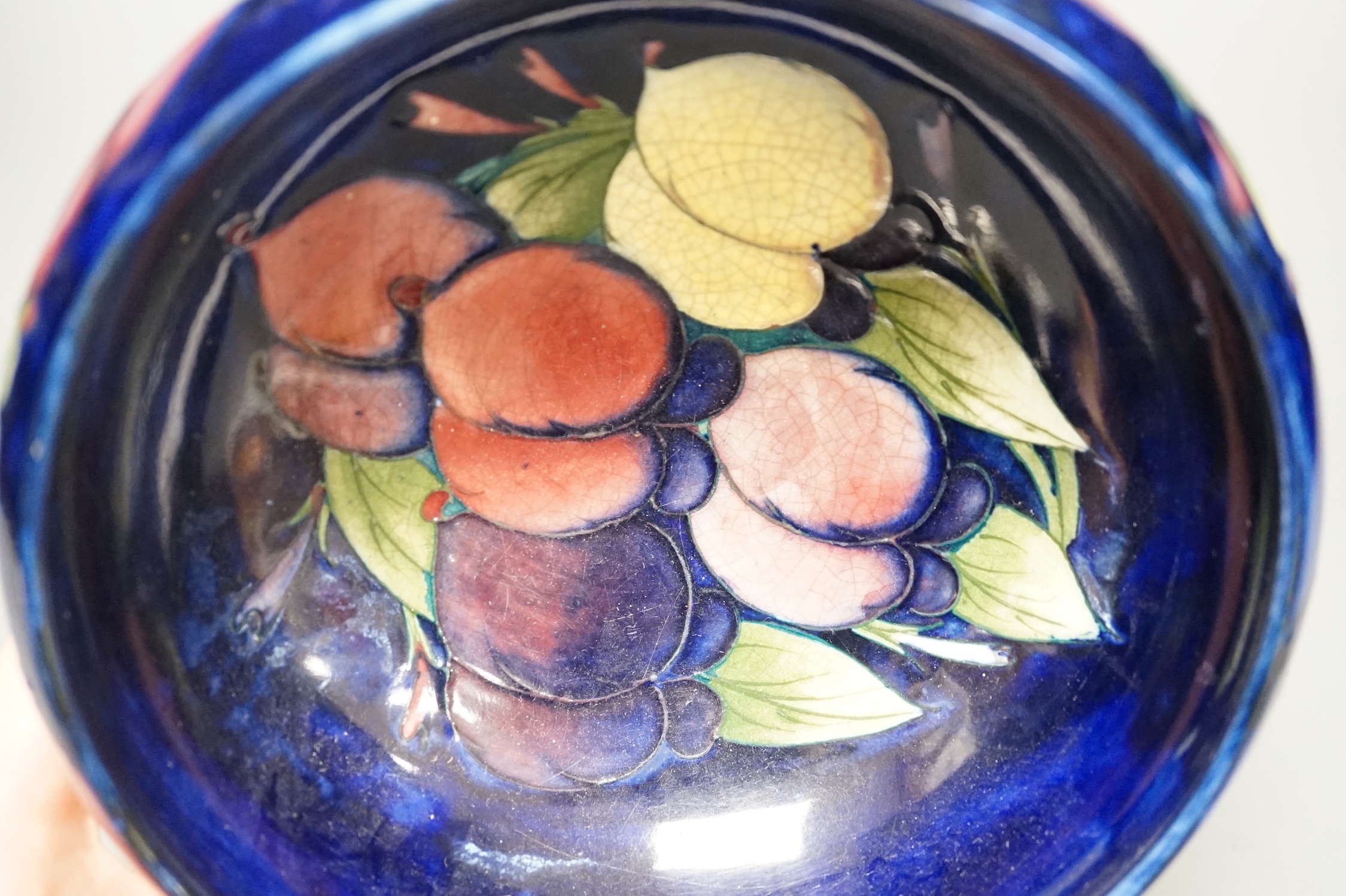 A Moorcroft Wisteria pattern bowl - 18cm wide